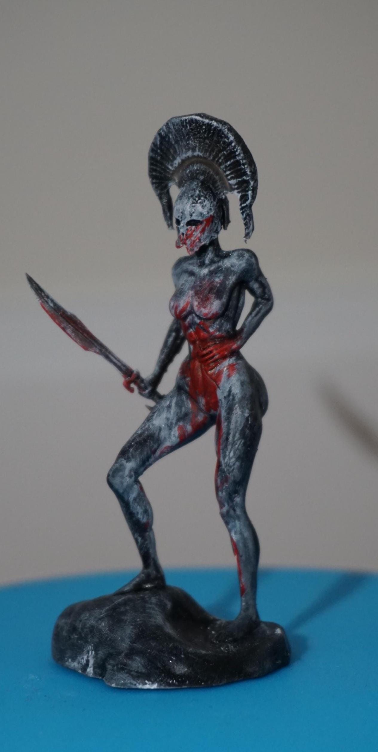 Endure – Wounded Hoplite Swordswoman Statue