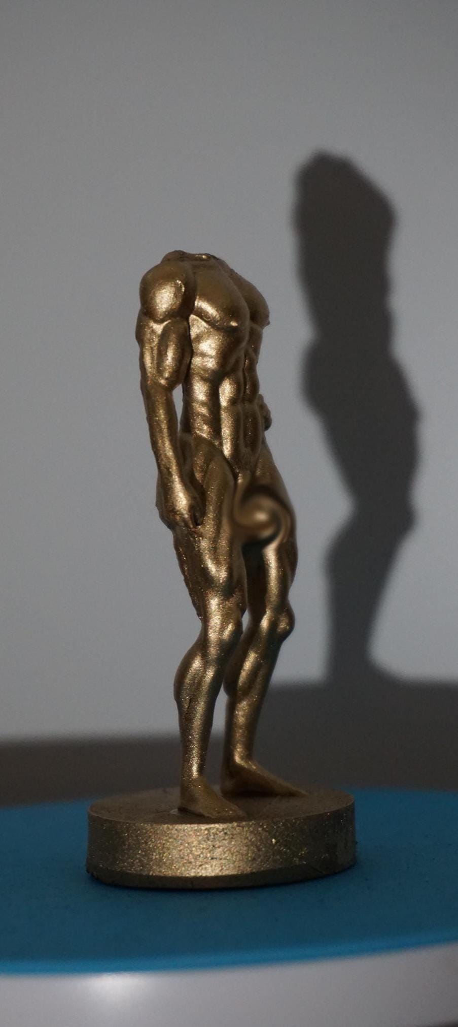 Gilded Strength Statue
