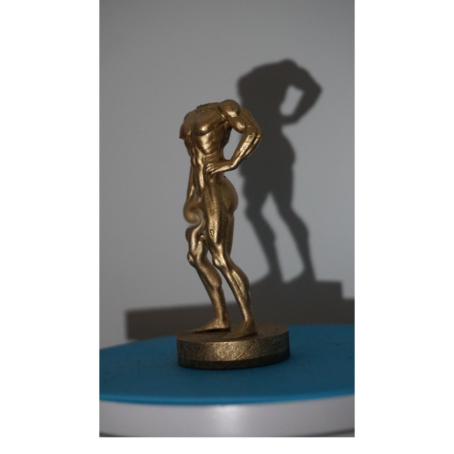 Gilded Strength Statue