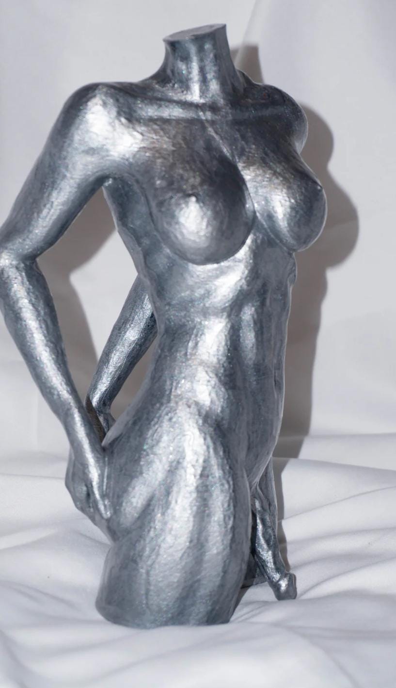 Transgender looking back - Statue